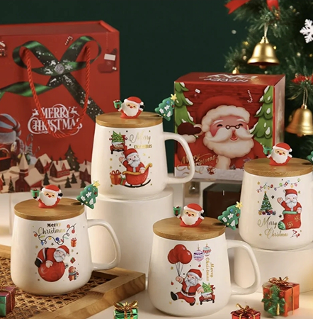 Set of Christmas-themed mugs with Santa Claus designs on a festive background.
