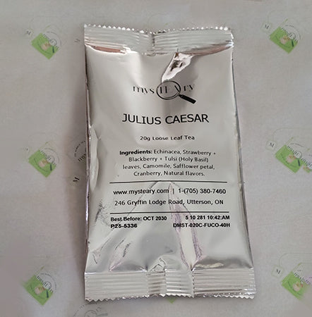 Tea package labeled 'Julius Caesar' on a light background