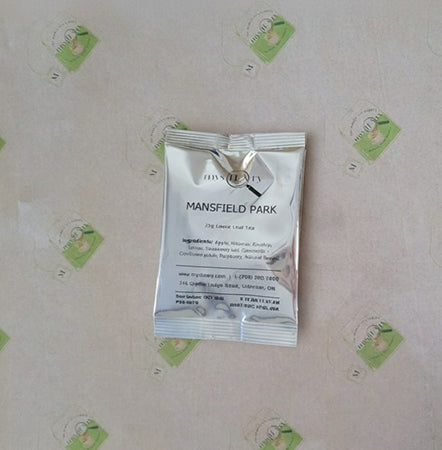 Tea package labeled 'Mansfield Park' on a light background with green labels.