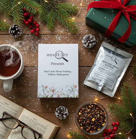Tea packaging with a cup of tea, book, and decorative elements on a wooden surface