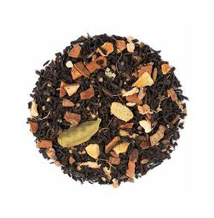 Mixture of black tea leaves with various spices on a white background
