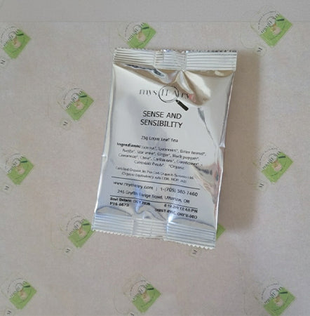 Silver packet labeled 'Sense and Sensibility' on a patterned background