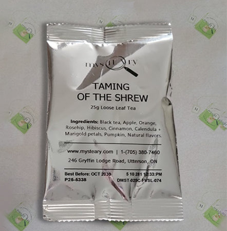 Tea package with 'Taming of the Shrew' branding on a light gray background