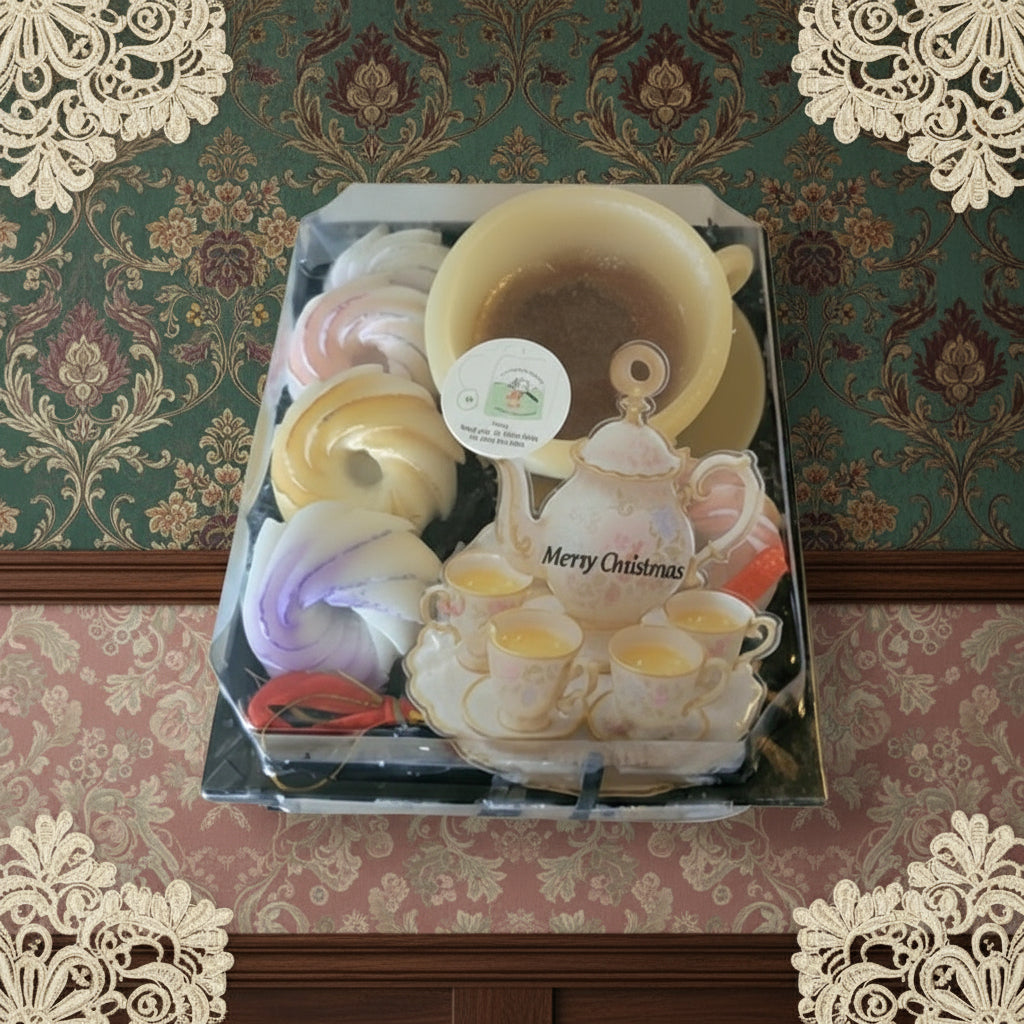Decorative set of soap bars with a teapot design on a floral wallpaper background
